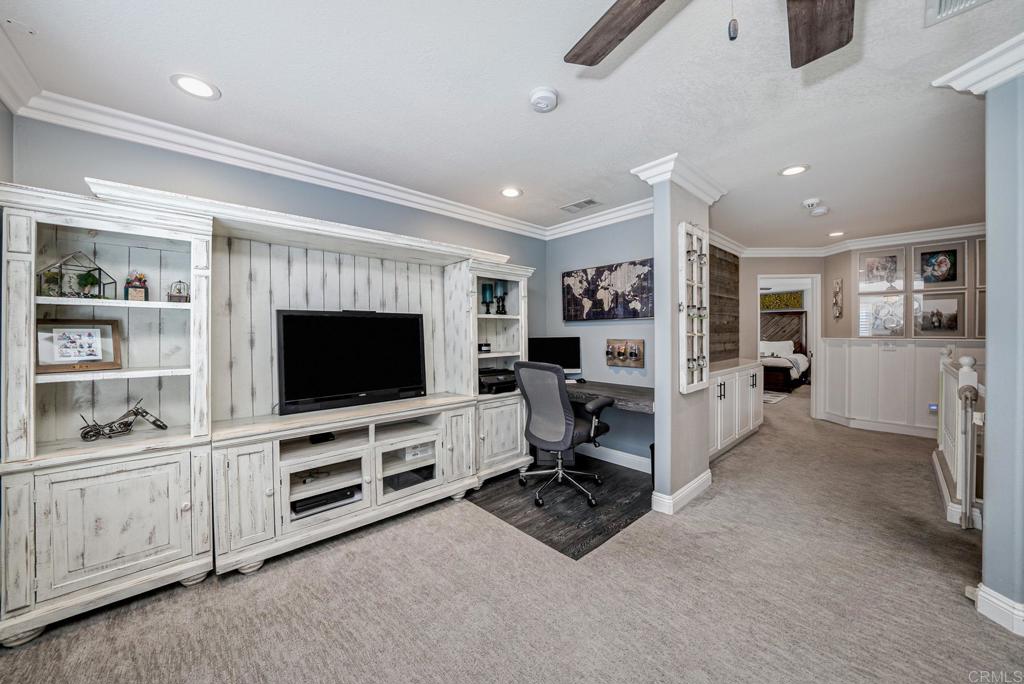 23 Wayfaire Rancho Santa Margarita, CA 92688 - Photo 11 of 44 a living room with furniture and a flat screen tv