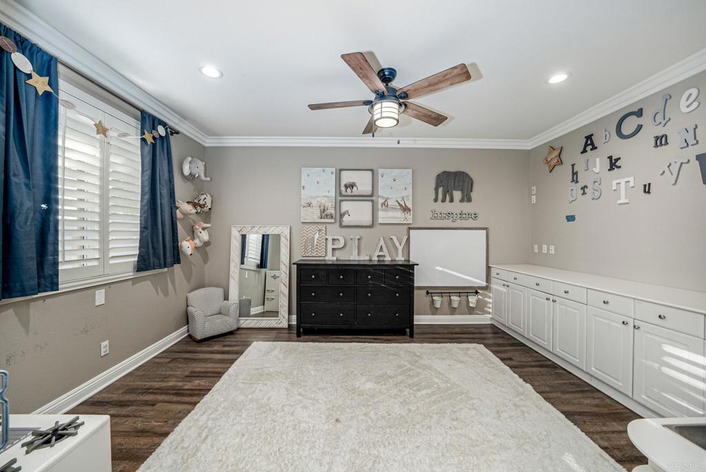 23 Wayfaire Rancho Santa Margarita, CA 92688 - Photo 12 of 44 a spacious bedroom with a bed and a dresser