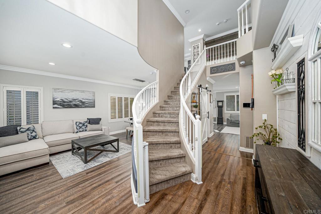 23 Wayfaire Rancho Santa Margarita, CA 92688 - Photo 17 of 44 a living room with wooden floor and furniture