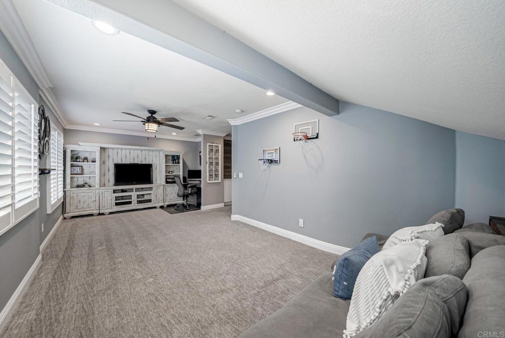 23 Wayfaire Rancho Santa Margarita, CA 92688 - Photo 18 of 44 a view of a livingroom with furniture and fireplace