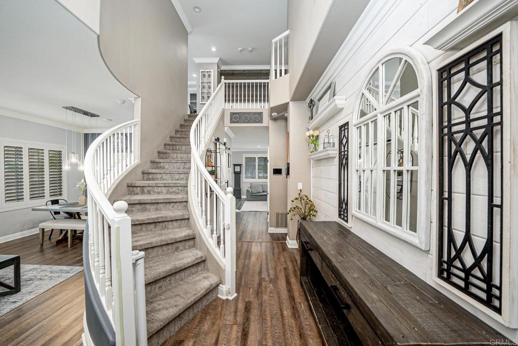 23 Wayfaire Rancho Santa Margarita, CA 92688 - Photo 2 of 44 a view of a hallway with wooden floor and staircase
