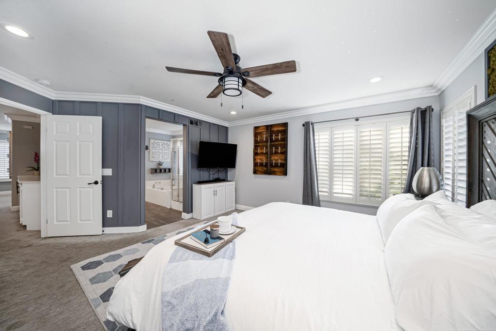 23 Wayfaire Rancho Santa Margarita, CA 92688 - Photo 22 of 44 a bedroom with a bed and a flat screen tv