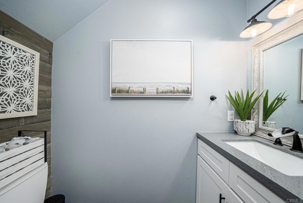 23 Wayfaire Rancho Santa Margarita, CA 92688 - Photo 25 of 44 a bathroom with a sink a vanity and a mirror