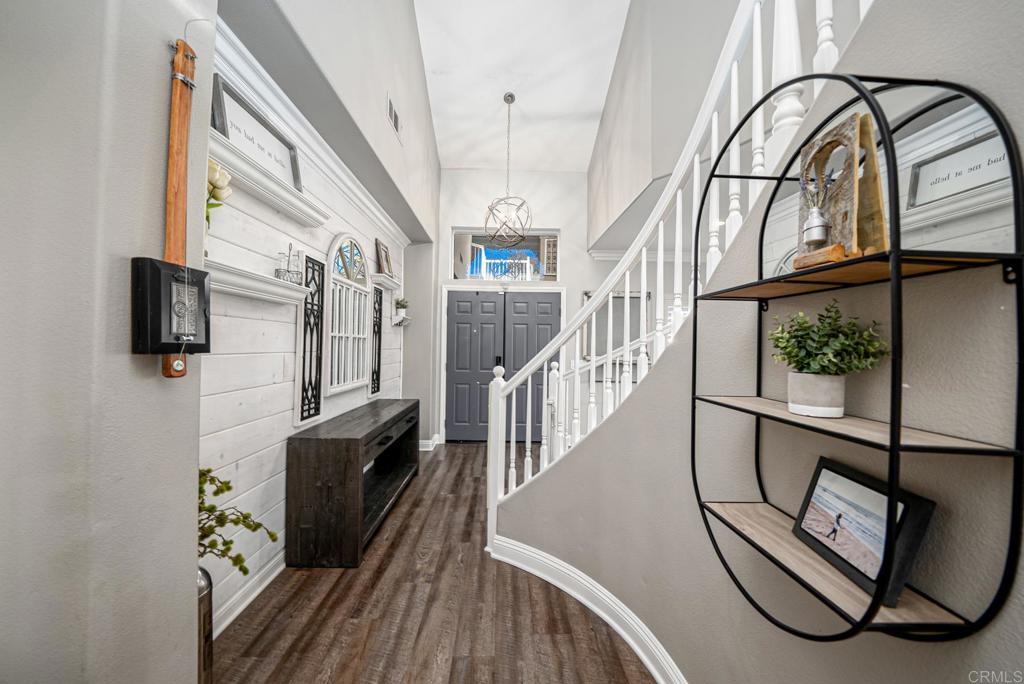 23 Wayfaire Rancho Santa Margarita, CA 92688 - Photo 26 of 44 a view of staircase with lots of frames on wall and a window