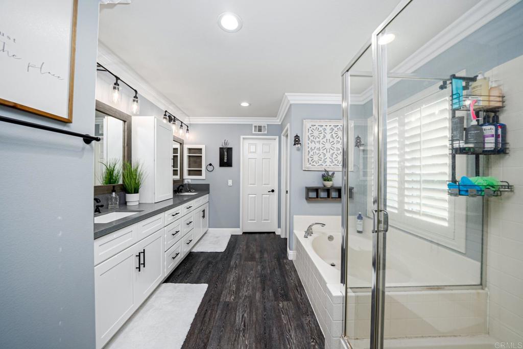 23 Wayfaire Rancho Santa Margarita, CA 92688 - Photo 27 of 44 a large white kitchen with stainless steel appliances granite countertop a refrigerator and a sink
