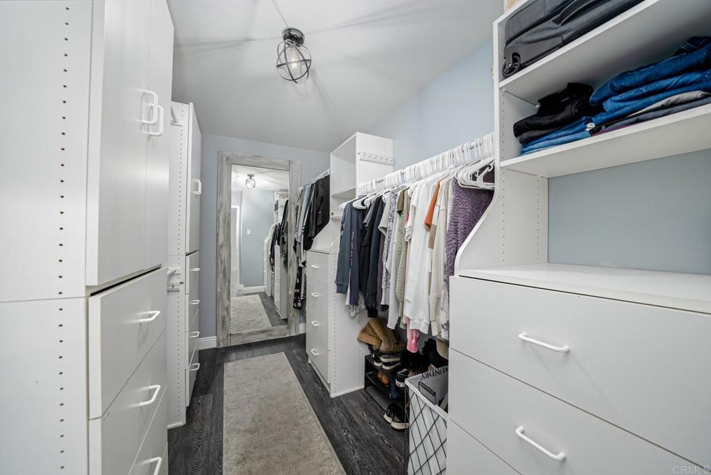 23 Wayfaire Rancho Santa Margarita, CA 92688 - Photo 30 of 44 a view of walk in closet with clothes and shoes