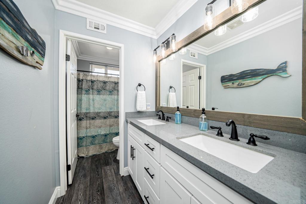 23 Wayfaire Rancho Santa Margarita, CA 92688 - Photo 31 of 44 a spacious bathroom with a double vanity sink a mirror and a shower