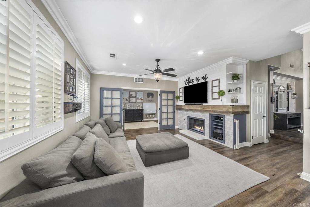 23 Wayfaire Rancho Santa Margarita, CA 92688 - Photo 4 of 44 a living room with fireplace furniture and a flat screen tv