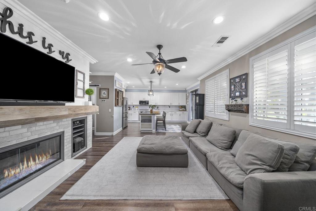 23 Wayfaire Rancho Santa Margarita, CA 92688 - Photo 6 of 44 a living room with furniture and a flat screen tv