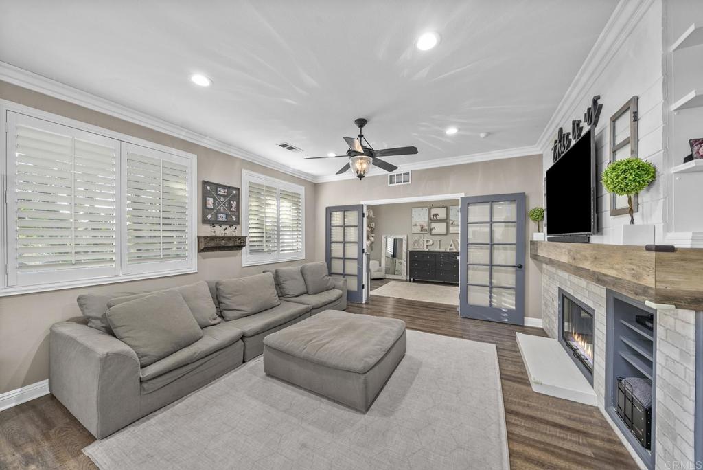 23 Wayfaire Rancho Santa Margarita, CA 92688 - Photo 7 of 44 a living room with furniture and a fireplace
