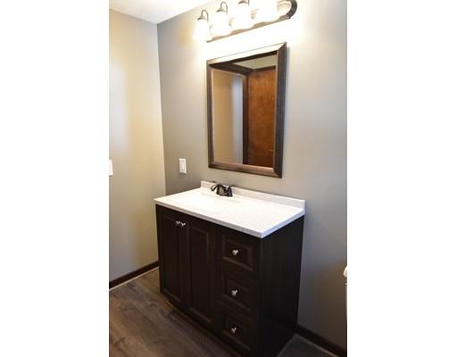 411 Southampton Road Holyoke, MA 01040 - Photo 13 of 27 a bathroom with a sink and a mirror