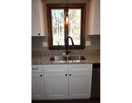 411 Southampton Road Holyoke, MA 01040 - Photo 5 of 27 a view of a bathroom with a sink and a mirror
