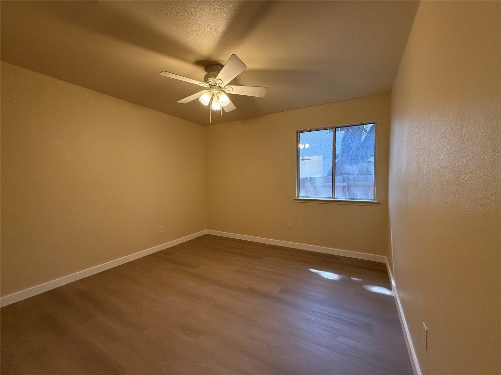 4526 Tello Path Austin, TX 78749 - Photo 17 of 24 an empty room with a window and a fan