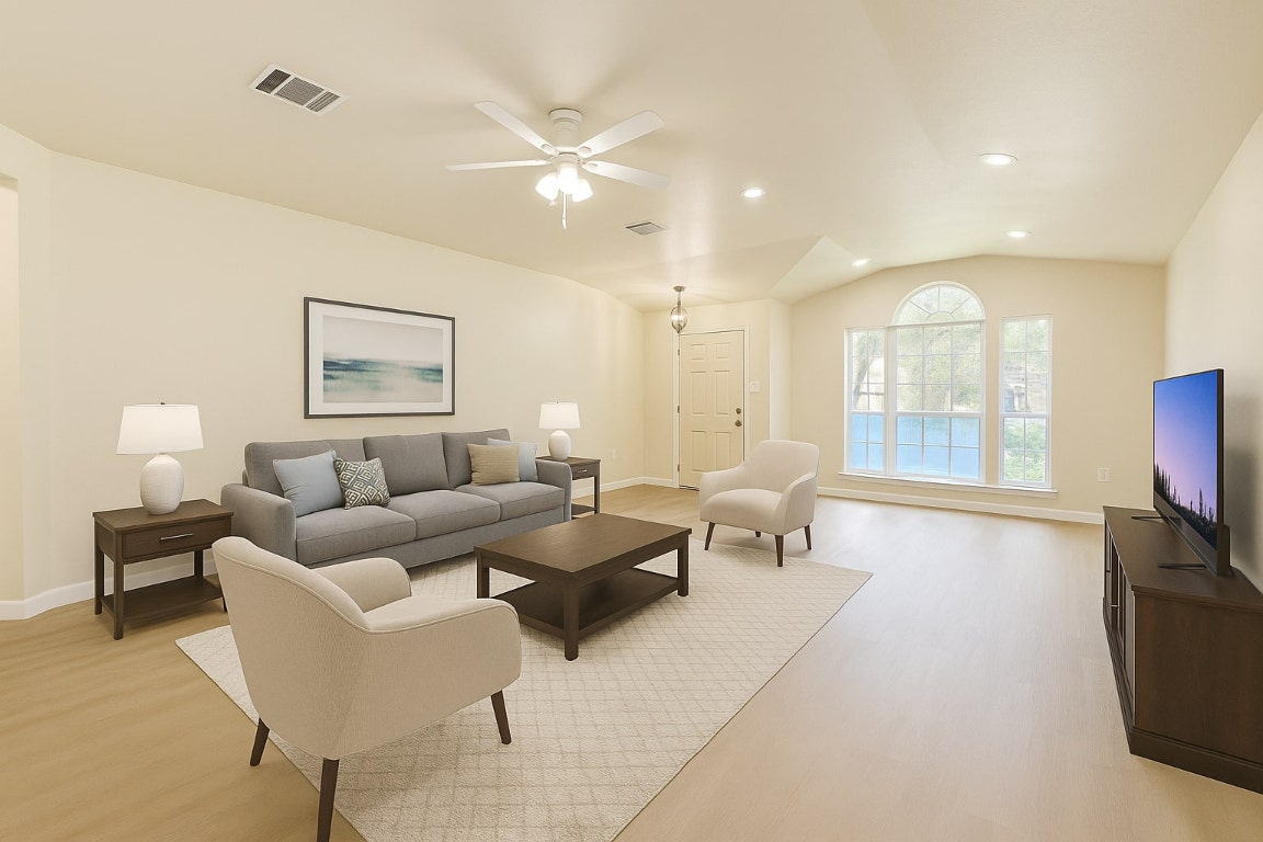 4526 Tello Path Austin, TX 78749 - Photo 5 of 24 a living room with furniture a large window and a flat screen tv