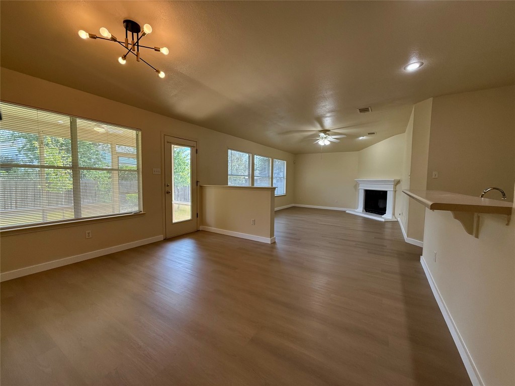 4526 Tello Path Austin, TX 78749 - Photo 6 of 24 an empty room with wooden floor and windows
