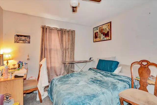 a bedroom with furniture and a bed