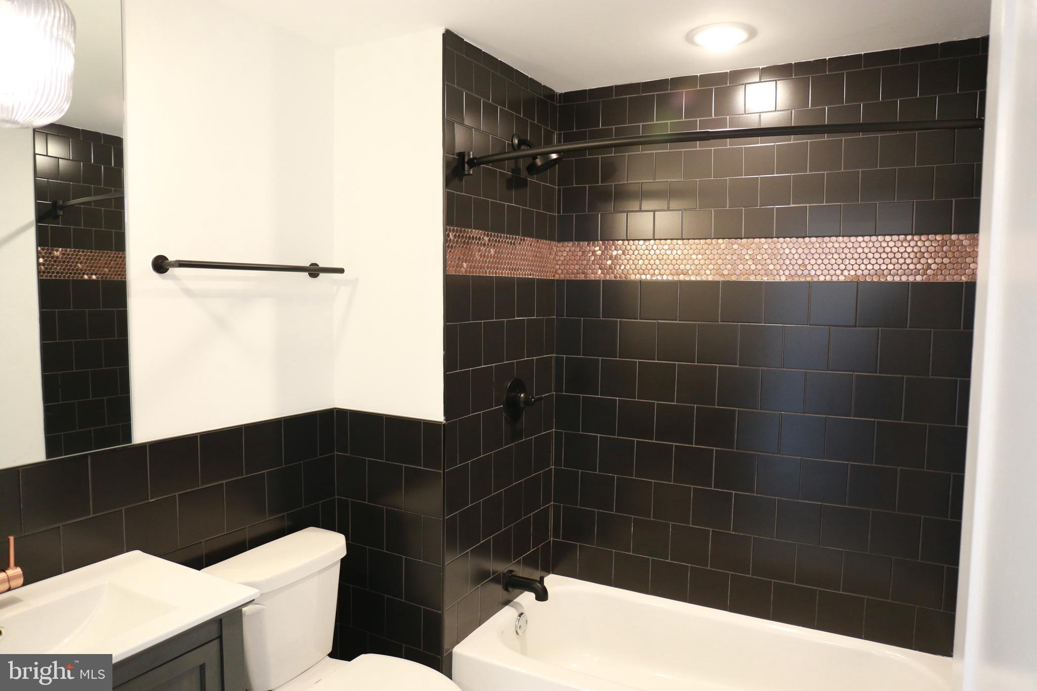 1111 South Broad Street, Unit 2BED/2BATH Philadelphia, PA 19147 - Photo 21 of 25 a bathroom with a toilet