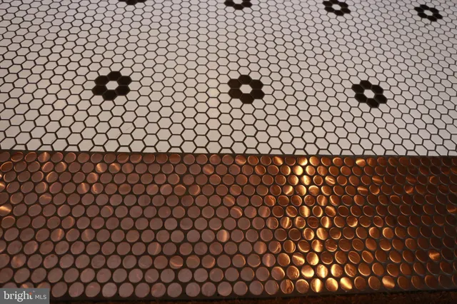 a living room with furniture a rug and a wall clock