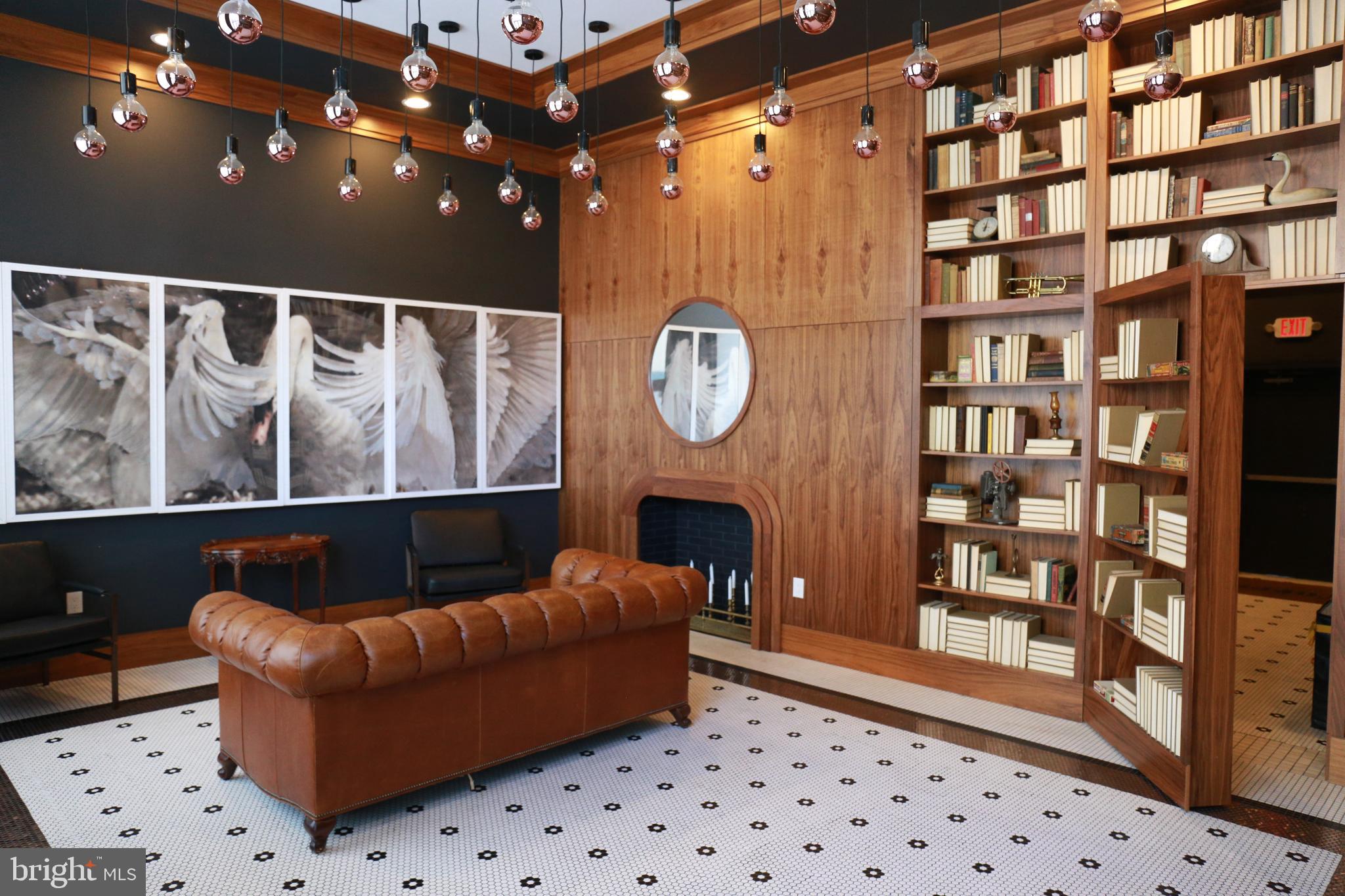 1111 South Broad Street, Unit 2BED/2BATH Philadelphia, PA 19147 - Photo 8 of 25 a living room with furniture a rug and a wall clock