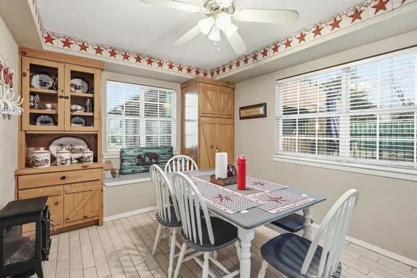 a view of a dining room with furniture window and outside view