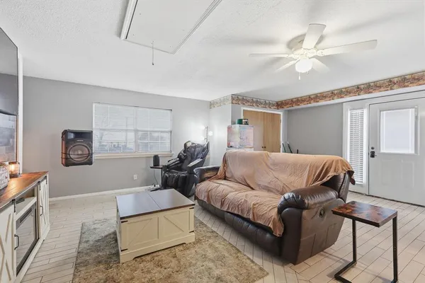 a living room with furniture and a window