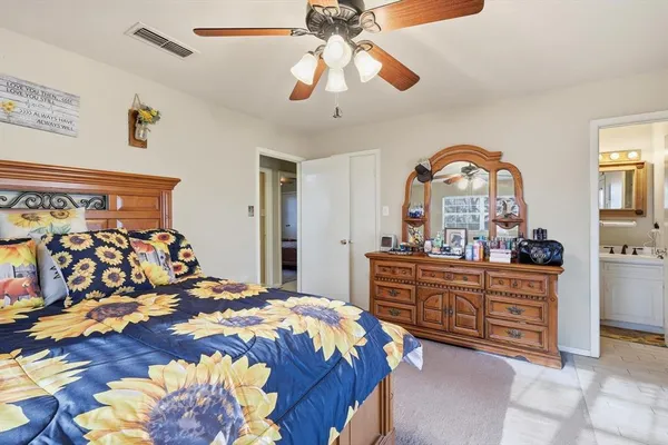 a bed room with a bed and a chandelier