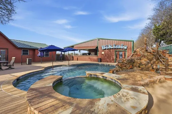 a view of a house with swimming pool