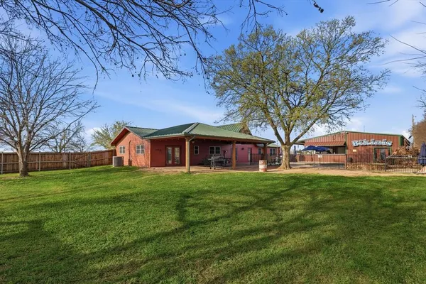 a view of a big yard next to a house