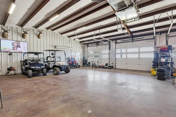 a view of a garage with parked cars