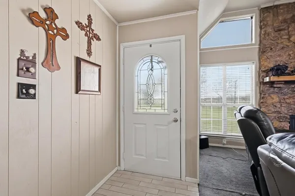 a view of a livingroom with furniture and windows