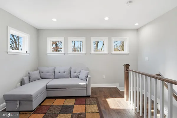 a living room with furniture and a rug
