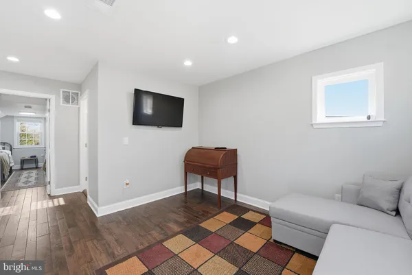 a living room with a couch and a flat screen tv