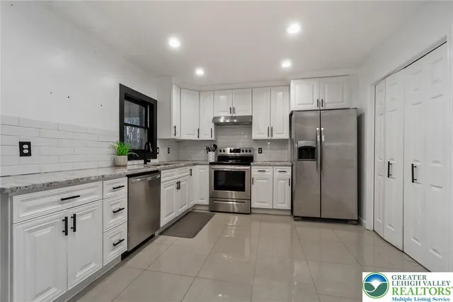 a utility room with lots of different colored cloths