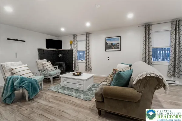a spacious bedroom with a bed and a large window
