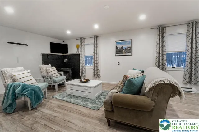 a dining room with furniture and window