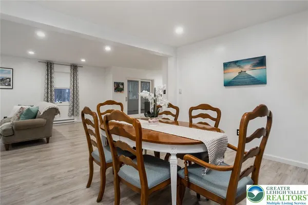 a dining room with furniture and window