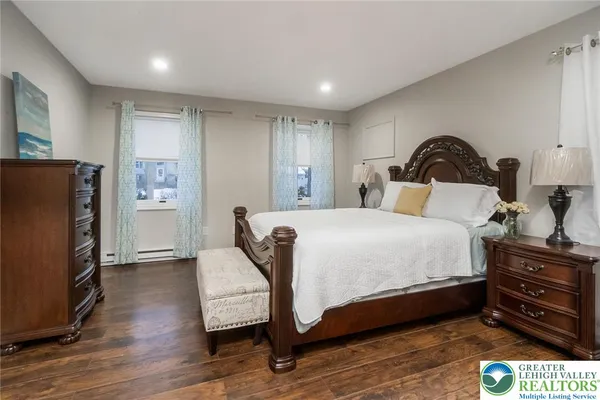 a bedroom with a bed and a dresser