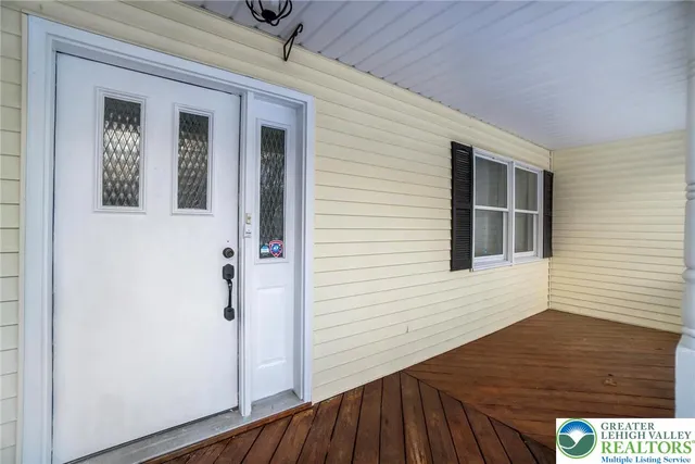 a view of a house with a snow in the yard