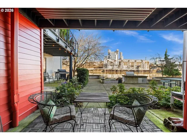 a view of a chairs and table in patio
