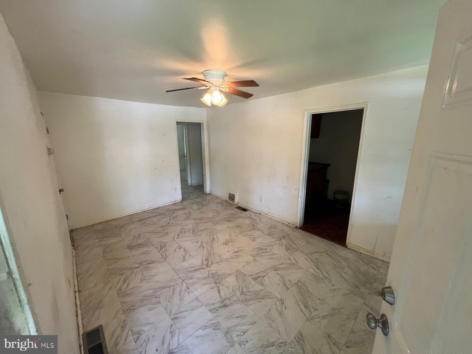 313 Cherry Hill Road Baltimore, MD 21225 - Photo 13 of 16 a view of empty room with a ceiling fan