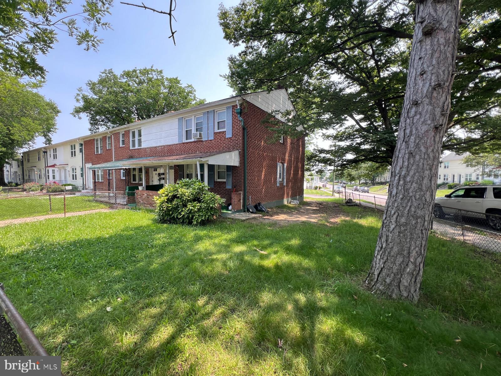 313 Cherry Hill Road Baltimore, MD 21225 - Photo 2 of 16 a house view with a garden space