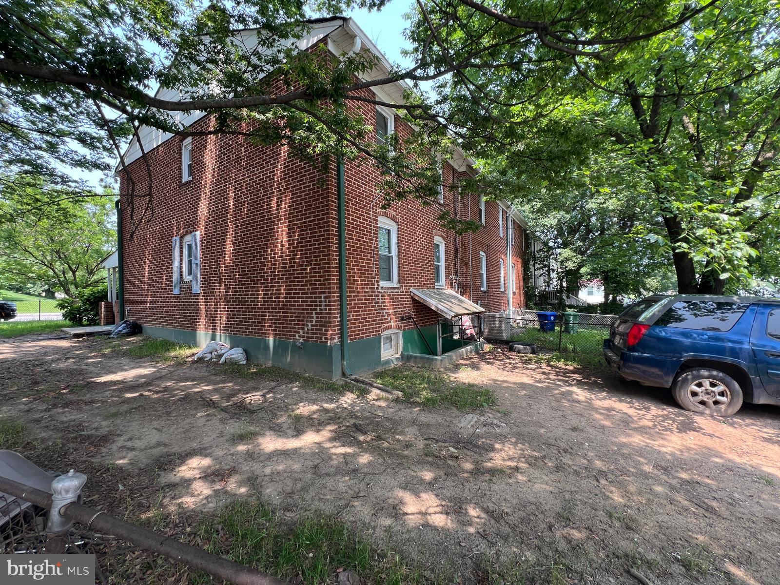 313 Cherry Hill Road Baltimore, MD 21225 - Photo 4 of 16 a view of a car parked in front of a house