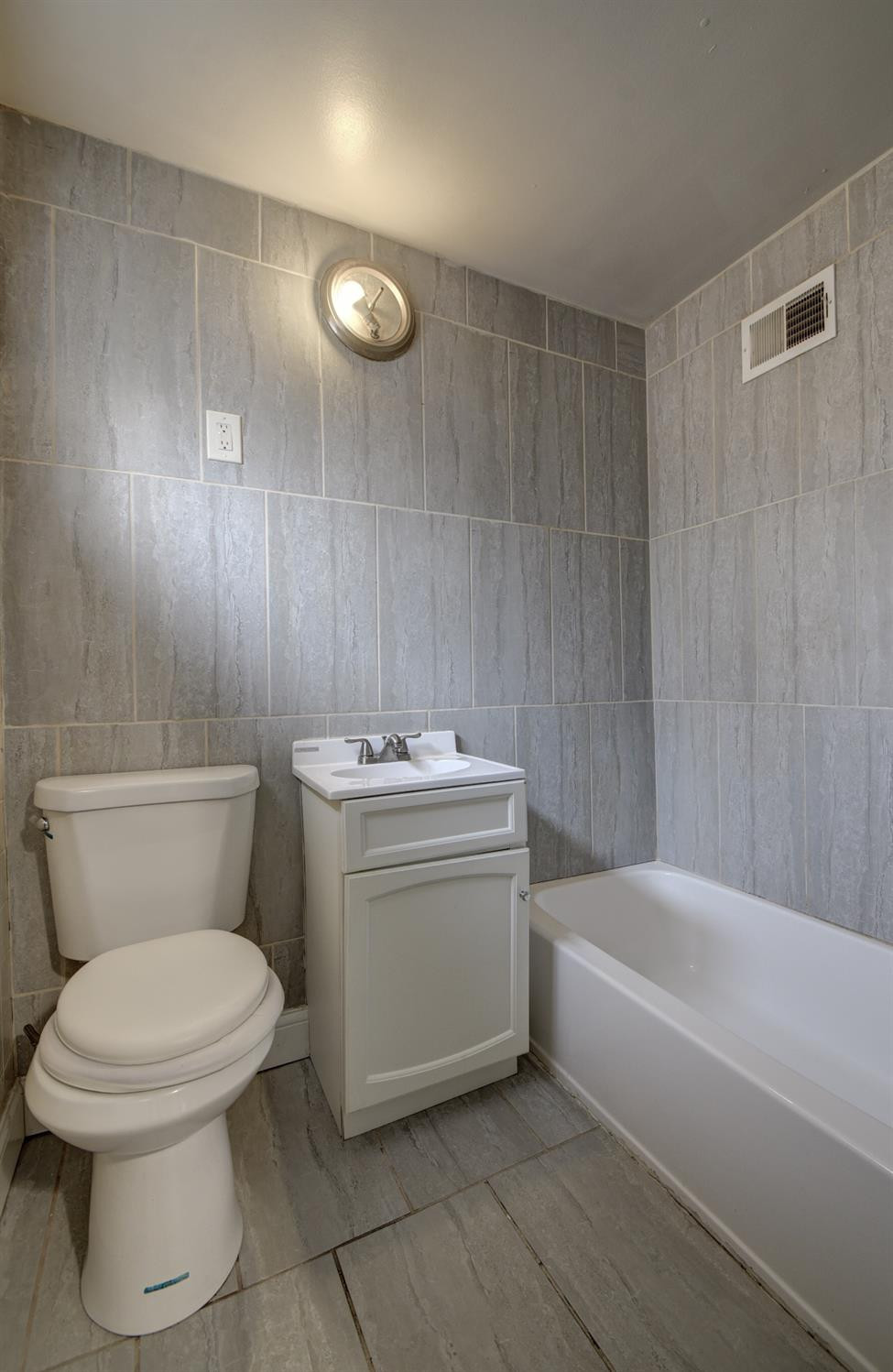 3044 West Ridge Road, Unit RD Gary, IN 46408 - Photo 13 of 13 a bathroom with a toilet sink and mirror