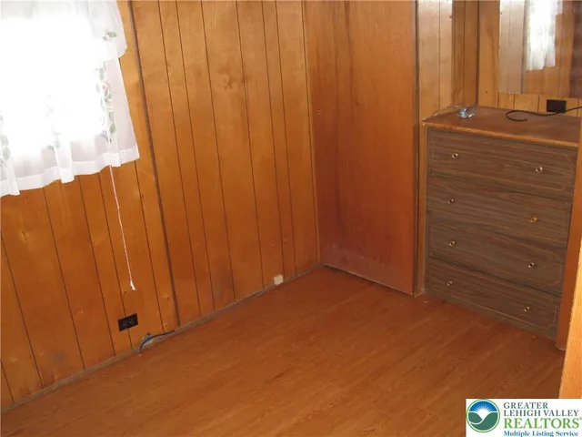 a white bath tub sitting next to a toilet