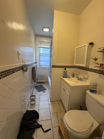a bathroom with a toilet and a sink