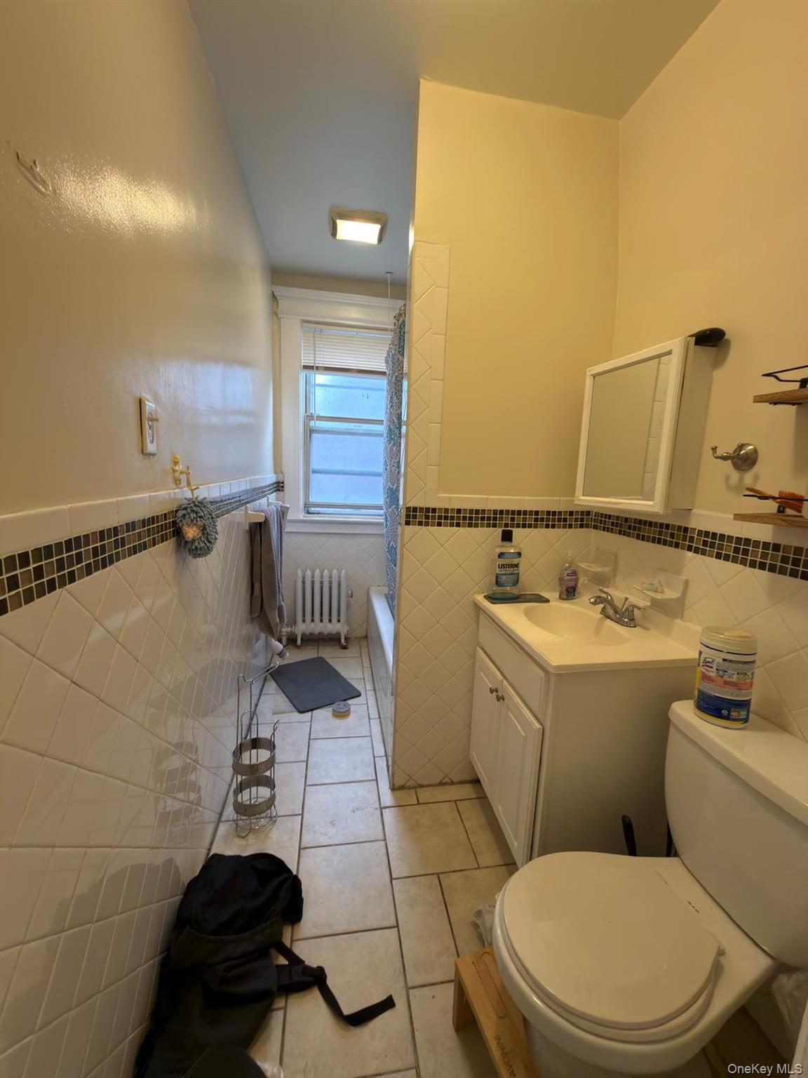 33-21 112th Street, Unit 2 Queens, NY 11368 - Photo 9 of 9 a bathroom with a toilet and a sink