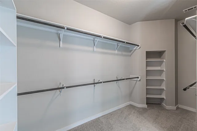 a view of an empty walk in closet
