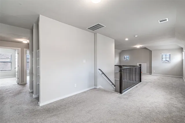 a view of a hallway with staircase