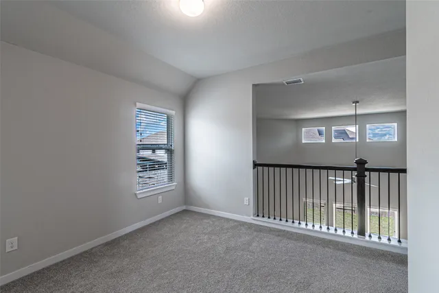 a view of a hallway with windows