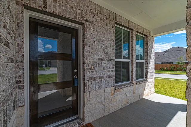 a view of an entryway of the house and a window